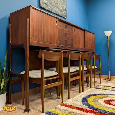 Danish Modern dining suite with drop-leaf table, 4 chairs, and credenza by Elliotts of Newbury, UK