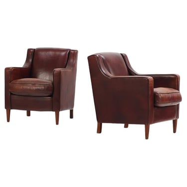 A Dutch pair of leather club chairs, C. 1960.