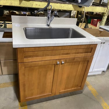 Freestanding Base with White Stone Countertop and Stainless Steel Sink