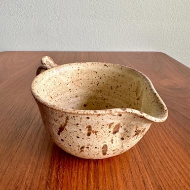 Vintage pottery cream pitcher or small gravy boat / speckled oatmeal-colored rustic pouring cup signed by artist 