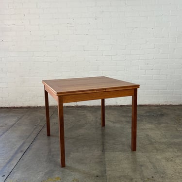 Compact draw leaf dining table 