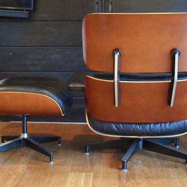 Restored Eames cherry lounge chair and ottoman by Herman Miller, circa 2002 