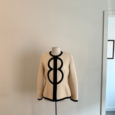 Bill Blass cream wool boucle with black trim edges & large logo at front center-size M 