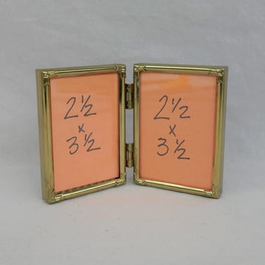 Small Vintage Hinged Double Picture Frame - Gold Tone Metal w/ Glass, Corner Decoration - Holds Two Wallet Size 2 1/2" x 3 1/2" Photos - 2x3 