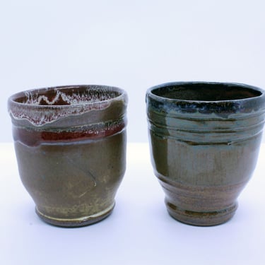 Ceramic cups- Handmade Stoneware with a shino glaze and cranberry glaze, and a cup with a shino glaze overlapped with a speckled blue 