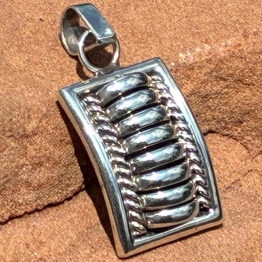 Tom Charley ~ Vintage Navajo Sterling Silver Pendant with Raised Bowed Ribbed Center 