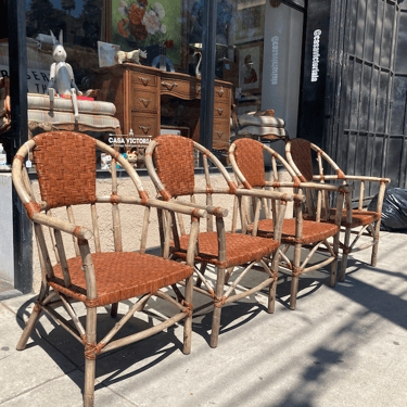 Back to Nature | Set of Four Rattan and Wicker Arm Chairs by Palecek of San Francisco