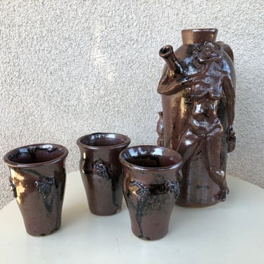 Vintage funky art pottery wine decanter pitcher with 3 cups tribal nude theme brown pottery signed M Hess 1981 