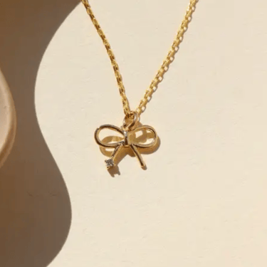 Petite bow charm necklace 