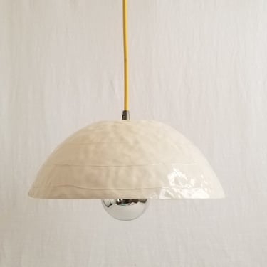 Dome pendant light. Handmade ceramic. White with red plug-in cord 