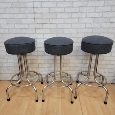 Vintage Industrial Swivel Bar Stools Newly Upholstered in a Charcoal Wool - 3 Piece Set