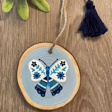 Folk Art Butterfly Ornament/ Blue and White Boho Christmas Decoration with Tassel/ Hand Painted Wood Slice Holiday Tree Decor 