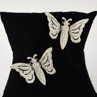 50's ORA rhinestones rhodium plate hinged butterfly dress clips, Art Deco style red-eyed winged insect bling coat clips 